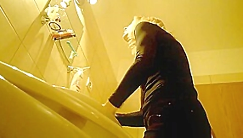 Blonde babe flashing pussy in toilet