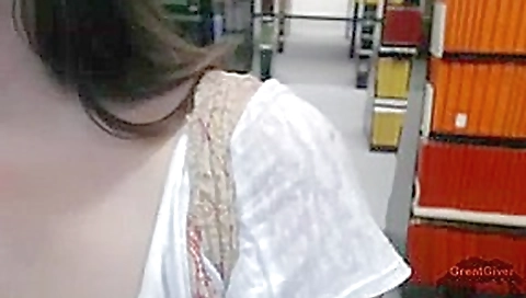 Sexy girl masturbating in a public library