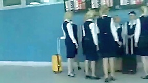 Busty stewardess gives handjob on bus, takes cumshot