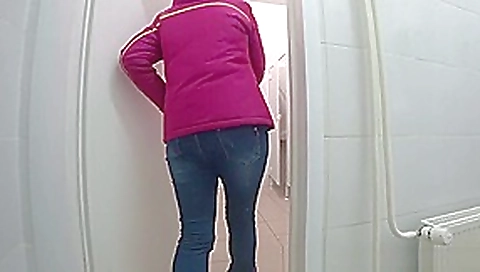 pissing a young girl in a public toilet