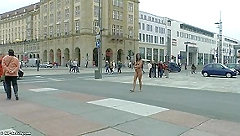 Long haired brunette walks naked in public in hd movie