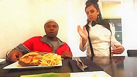 Waitress takes a BBC break behind the restaurant